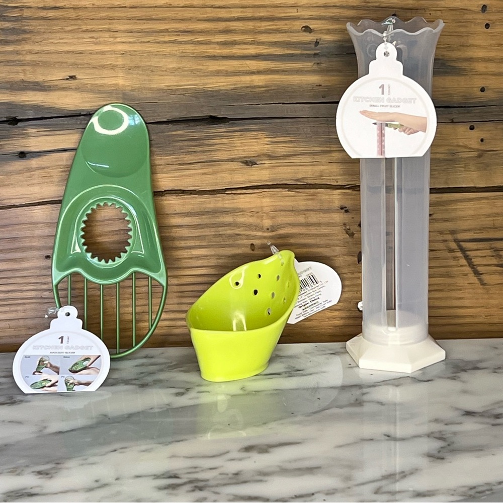 Set of three kitchen gadgets - avocado peeler, berry slicer, herb stripper